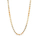 A moonstone chain necklace with varying hues of orange, cream, and gray, stones strung on an 18k yellow gold chain.