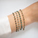 Bracelet stack with diamonds on a person