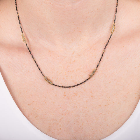 Oxidized silver and 18k gold necklace with silver diamonds
