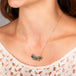 Boulder opal necklace on model