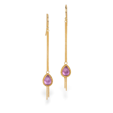 A pair of gold drop earrings with teardrop-shaped pink sapphire gemstones, shown against a plain white background.