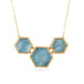 Necklace with hexagonal aquamarine stones and gold accents on a white background