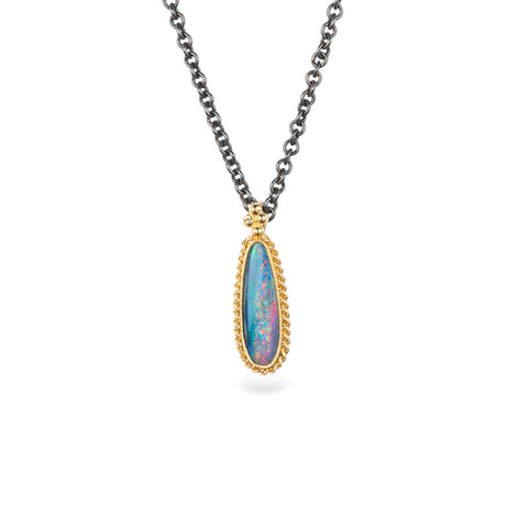 Handmade necklace featuring an Australian opal doublet stone set in an 18k gold bezel and paired with an oxidized silver chain.