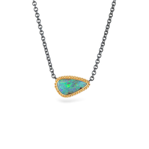 Boulder opal necklace with an 18k gold bezel and oxidized silver chain.