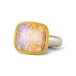Handmade ring featuring a boulder opal gemstone set in an 18k gold bezel and paired with a sterling silver band, against a white background.
