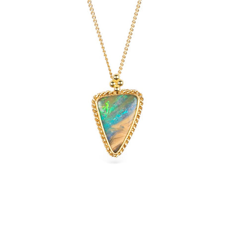 Gold necklace with a boulder opal gemstone on a white background