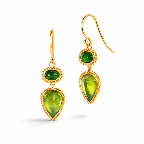 Gold earrings featuring chrome diopside and peridot gemstones, shown against a white background.
