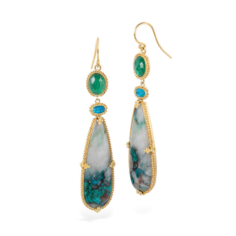 Gold earrings with chrysocolla, emerald and apatite stones on a white background
