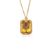 Gold necklace featuring a citrine gemstone, shown against a white background.