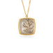 Gold necklace featuring a dendritic stone against a white background