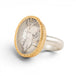 Gold and silver ring featuring a dendritic quartz stone on a white background