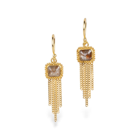 A pair of gold dangle earrings with square diamonds and gold chain tassels, shown on a clean white background.
