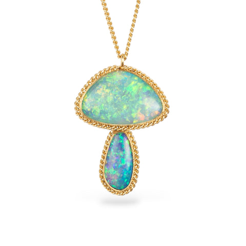 Boulder opal pendant necklace in mushroom design on a gold chain against a white background