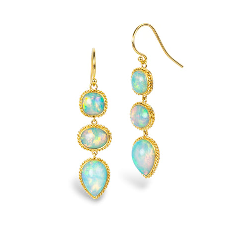 Gold earrings featuring a trio of ethiopian opals, against a white background.