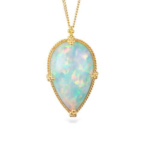 Ethiopian opal pendant necklace with gold bezel on a white background