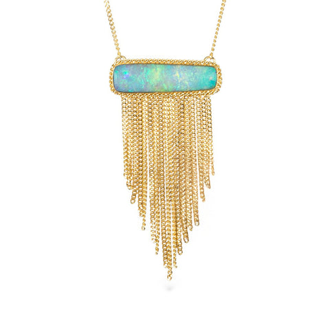 A necklace featuring an ethiopian opal draped with a gold tassel