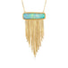 A necklace featuring an ethiopian opal draped with a gold tassel