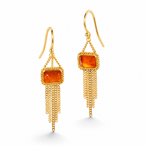 Gold earrings featuring fire opal gemstones and gold chain tassels, shown against a white background.