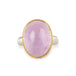 A ring featuring a large oval kunzite stone, set in a gold textured bezel with a sterling silver band.