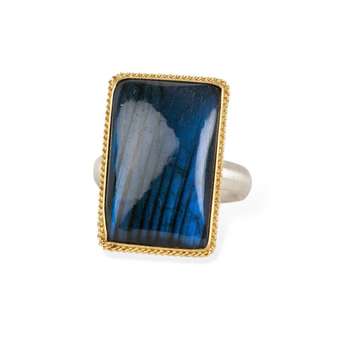Handmade fine jewelry labradorite ring set in 18k gold with a sterling silver band