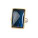Handmade fine jewelry labradorite ring set in 18k gold with a sterling silver band