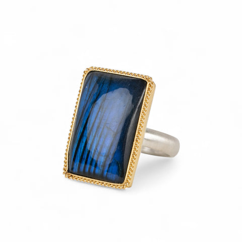 Handmade fine jewelry labradorite ring set in 18k gold with a sterling silver band