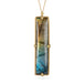Handmade 18k gold necklace with a rectangular labradorite gemstone on a white background.