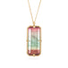 Handmade ecklace with a watermelon tourmaline gemstone set in a gold bezel on a white background