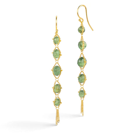 Gold earrings featuring rows of green apatite gemstones, shown against a white background.