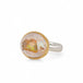 Ring with Mexican opal stone, gold bezel and sterling silver band on a white background