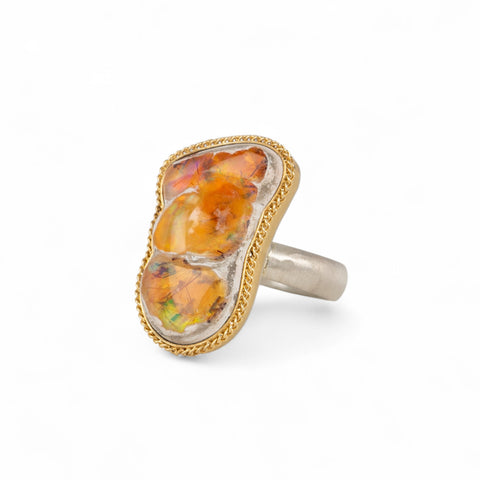 Handcrafted one-of-a-kind ring with a mexican opal gemstone, 18k gold bezel and sterling silver band