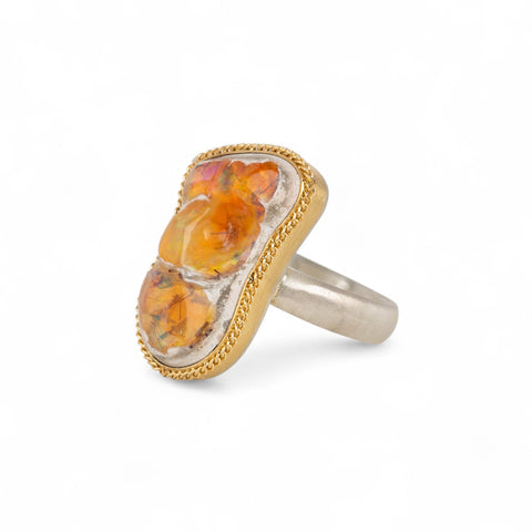 Handcrafted one-of-a-kind ring with a mexican opal gemstone, 18k gold bezel and sterling silver band