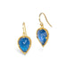A pair of gold drop earrings featuring pear-shaped blue iridescent moonstones, set in textured gold bezels, shown on a plain white background.