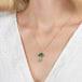 Boulder opal mushroom necklace with gold frame on a person