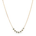 18k yellow gold chain necklace featuring a row of seven blue diamonds in the center.