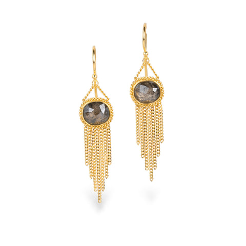 A pair of gold dangle earrings with oval diamond gemstones and cascading gold chain fringe, shown on a clean white background.