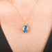 Handmade gold necklace with a moonstone pendant in an 18k gold bezel on a person