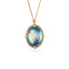 Handmade gold necklace with a moonstone pendant in an 18k gold bezel on a white background
