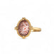 Handmade 18k gold ring featuring a Super 7 gemstone on a white background.