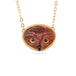 Gold necklace featuring a carved owl pendant made from garnet with an onyx beak, shown against a white backdrop.
