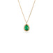 Gold necklace with a petite emerald gemstone set in a handmade gold bezel on a white background.