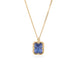 Gold necklace with a tanzanite gemstone set in a handmade gold bezel on a white background