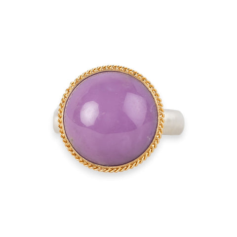 A gold and silver ring featuring a phosphosiderite stone, shown against a white background.
