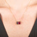 Necklace with a watermelon tourmaline gemstone pendant on a person