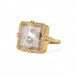 Handmade 18k gold ring with a large quartz on a white background.