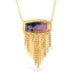Gold necklace with a ruby sapphire gemstone pendant on a white background