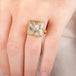 A model wears a quartz and 18k yellow gold ring.
