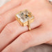 A model wears a unique quartz and 18k gold ring.