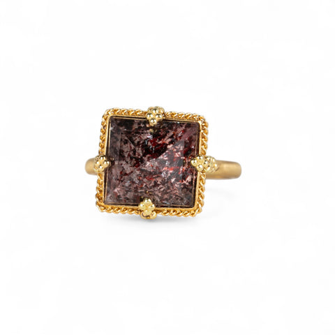 Gold ring with a square Super 7 gemstone on a white background.