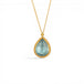A gold necklace featuring a teardrop-shaped aquamarine necklace, shown against a white background.